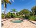 Community spa surrounded by tropical foliage at 6406 Grand Estuary Trl # 102, Bradenton, FL 34212