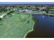 Aerial view of the golf course, lakes, and clubhouse at the Tara Golf and Country Club at 6612 Butlers Crest Dr, Bradenton, FL 34203