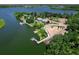 Breathtaking aerial view of waterfront property with docks and lush greenery at 6612 Butlers Crest Dr, Bradenton, FL 34203