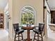 Cozy breakfast nook with an arched window looking out to the pool at 6612 Butlers Crest Dr, Bradenton, FL 34203