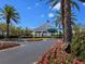 Tara Golf and Country Club entrance with lush landscaping and mature palm trees at 6612 Butlers Crest Dr, Bradenton, FL 34203