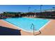 Community pool at Tara Golf and Country Club, featuring lounge chairs and shaded areas at 6612 Butlers Crest Dr, Bradenton, FL 34203