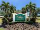 Entrance sign for Tara Golf & Country Club surrounded by lush landscaping and palm trees at 6612 Butlers Crest Dr, Bradenton, FL 34203