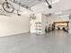 Spacious garage with epoxy flooring and high ceilings, offering ample space for parking and storage at 6612 Butlers Crest Dr, Bradenton, FL 34203