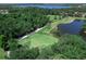 Aerial view of a pristine green at Tara Golf and Country Club, surrounded by lush landscaping at 6612 Butlers Crest Dr, Bradenton, FL 34203