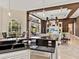 Bright kitchen with a connected living room and outdoor patio, featuring modern stainless appliances and an island at 6612 Butlers Crest Dr, Bradenton, FL 34203