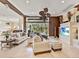 Bright living room featuring neutral tones, stylish furniture, and a view of the backyard pool at 6612 Butlers Crest Dr, Bradenton, FL 34203