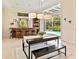 Bright dining and bar area with views to a swimming pool and natural light at 6612 Butlers Crest Dr, Bradenton, FL 34203