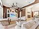 Spacious living room featuring cozy seating, elegant decor, and a large entertainment center at 6612 Butlers Crest Dr, Bradenton, FL 34203