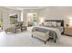Tranquil main bedroom retreat with ensuite bathroom, chaise, and natural light at 6612 Butlers Crest Dr, Bradenton, FL 34203
