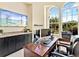 Home office with built-in cabinets, workspace, and large windows providing plenty of natural light at 6612 Butlers Crest Dr, Bradenton, FL 34203