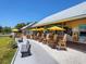 Charming outdoor seating area with umbrellas, perfect for relaxing and enjoying the views at 6612 Butlers Crest Dr, Bradenton, FL 34203