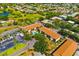 Aerial view showcasing the community's layout, including buildings, pool, landscaping, and surrounding neighborhood at 7201 Curtiss Ave # 2D, Sarasota, FL 34231