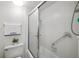 Clean bathroom with a tiled shower and sliding glass doors at 7201 Curtiss Ave # 2D, Sarasota, FL 34231