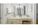 A bright bathroom with a large mirror and lots of counter space at 7201 Curtiss Ave # 2D, Sarasota, FL 34231