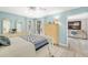 Bright bedroom with a large window and blue accent wall at 7201 Curtiss Ave # 2D, Sarasota, FL 34231