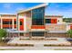 The Gulf Gate Library is a modern building featuring large windows, stone accents, and landscaped surroundings at 7201 Curtiss Ave # 2D, Sarasota, FL 34231