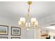 Close up of a stylish, modern chandelier above the dining area at 7201 Curtiss Ave # 2D, Sarasota, FL 34231