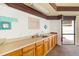 Clubhouse with sink, counter, white walls, and a view of the exterior at 7201 Curtiss Ave # 2D, Sarasota, FL 34231