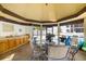 Inside the gazebo featuring a dining table, kitchenette area, and seating for poolside gatherings and relaxation at 7201 Curtiss Ave # 2D, Sarasota, FL 34231