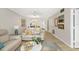 Inviting living room with soothing colors and furnishings showing open layout with dining and kitchen at 7201 Curtiss Ave # 2D, Sarasota, FL 34231