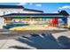 Colorful mural reading, 'Welcome to Siesta Key', with a lifeguard stand on a sunny beach at 7201 Curtiss Ave # 2D, Sarasota, FL 34231