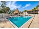 A refreshing community pool with an adjacent gazebo, perfect for outdoor relaxation and entertaining residents at 7201 Curtiss Ave # 2D, Sarasota, FL 34231