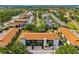 Aerial view of condo complex showing lush landscaping, mature trees and the surrounding neighborhood at 7203 Curtiss Ave # 3D, Sarasota, FL 34231