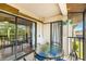 Inviting screened balcony with seating area perfect for outdoor enjoyment at 7203 Curtiss Ave # 3D, Sarasota, FL 34231