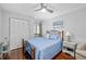 Comfortable bedroom featuring hardwood floors, a bed, closet and a window at 7203 Curtiss Ave # 3D, Sarasota, FL 34231