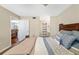 Comfortable bedroom featuring hardwood floors, and access to the living room and bathroom at 7203 Curtiss Ave # 3D, Sarasota, FL 34231