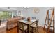 Dining room with wood floors, stylish table set, and plenty of natural light coming in from living room at 7203 Curtiss Ave # 3D, Sarasota, FL 34231