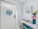 Bright entryway featuring an organized key rack and stylish console table at 7203 Curtiss Ave # 3D, Sarasota, FL 34231