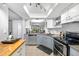 Bright kitchen with stainless steel appliances, ample counter space, and views of the dining area at 7203 Curtiss Ave # 3D, Sarasota, FL 34231