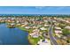 An aerial view of a neighborhood with waterfront properties and access to the ocean at 75 Inlets Blvd # 75, Nokomis, FL 34275