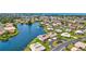 Scenic aerial perspective capturing waterfront houses on a community lakeside property at 75 Inlets Blvd # 75, Nokomis, FL 34275