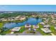 Beautiful aerial view of a waterfront home with lush landscaping and gorgeous curb appeal in a desirable neighborhood at 75 Inlets Blvd # 75, Nokomis, FL 34275