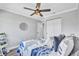 Bedroom with a ceiling fan, laminate flooring, and a closet at 75 Inlets Blvd # 75, Nokomis, FL 34275