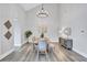 Dining space boasts high ceilings, natural light, and modern decor at 75 Inlets Blvd # 75, Nokomis, FL 34275