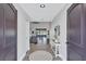 Bright foyer with wood flooring, opening up to a spacious living area and scenic views of the waterfront at 75 Inlets Blvd # 75, Nokomis, FL 34275