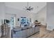 Open-concept living room showcasing water views, stylish seating, and wood flooring throughout at 75 Inlets Blvd # 75, Nokomis, FL 34275