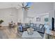 Bright and airy living room with vaulted ceilings, wood flooring, and stylish decor and water views at 75 Inlets Blvd # 75, Nokomis, FL 34275