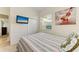 Comfortable bedroom with a window, closet, and a TV, offering a relaxing retreat at 7574 Camden Harbour Dr, Bradenton, FL 34212