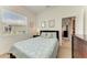 Inviting bedroom with a window view, wooden furniture, and comfortable bedding at 7574 Camden Harbour Dr, Bradenton, FL 34212