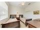 Well-lit bedroom with two beds, a ceiling fan, and ample closet space at 7574 Camden Harbour Dr, Bradenton, FL 34212