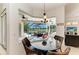Cozy breakfast nook with large windows offering views of the pool and outdoor space at 7574 Camden Harbour Dr, Bradenton, FL 34212