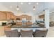 Large kitchen with granite countertops, modern appliances, and counter seating at 7574 Camden Harbour Dr, Bradenton, FL 34212