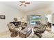 Cozy sitting area with four rattan chairs and a view to the pool and lanai at 7574 Camden Harbour Dr, Bradenton, FL 34212