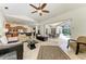 Spacious open concept living area with view into the kitchen and the screened in patio and pool at 7574 Camden Harbour Dr, Bradenton, FL 34212
