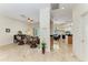 Bright and open living area with views of the pool and seamlessly connected spaces at 7574 Camden Harbour Dr, Bradenton, FL 34212